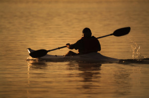 man-riding-kayak