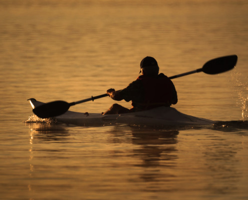 man-riding-kayak