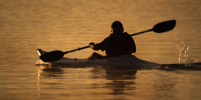 man-riding-kayak